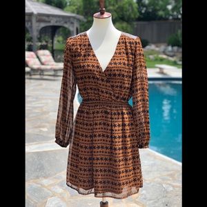 Skies are blue S brown and black stars dress